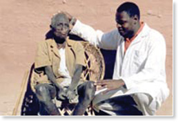 A helper with one of the residents